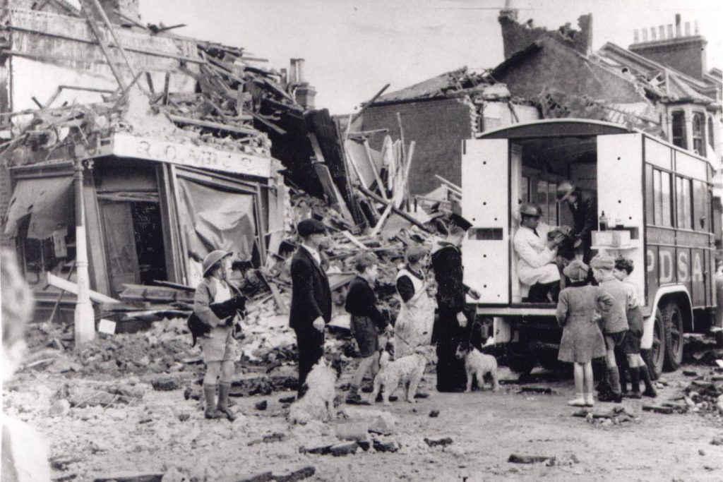 People awaiting services amid the rubble caused by the Blitz bombings