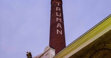 Truman Brewery chimney, with the word Truman spelt out in white bricks, on Brick Lane, East London.