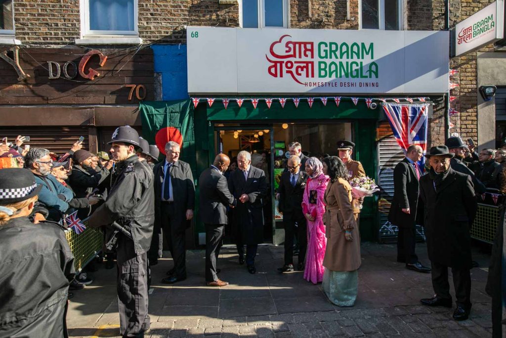 King Charles photographed outside the Brick Lane curry house Graam Bangla during his visit to Brick Lane.