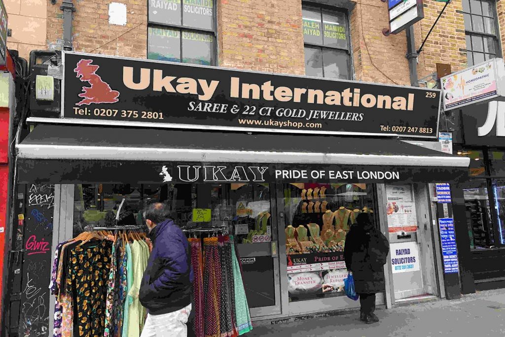 Ukay International saree shop on Whitechapel Highstreet, displaying high-end South Asian clothing and jewellery for sale.
