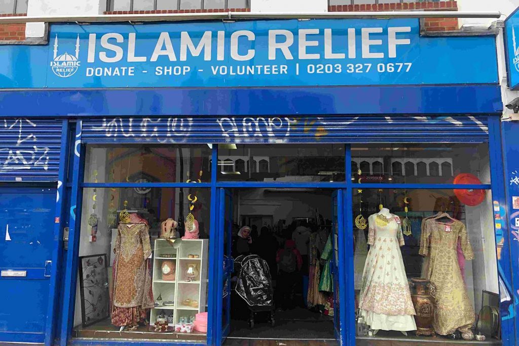 Islamic Relief charity shop on Whitechapel Highstreet, displaying sarees for sale through the window