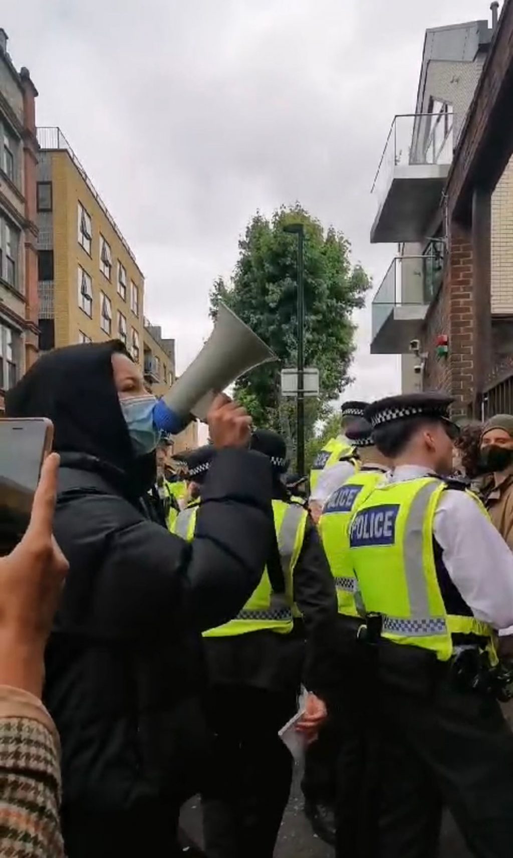 protesters-stood-with-police-at-booth-house-whitechapel 