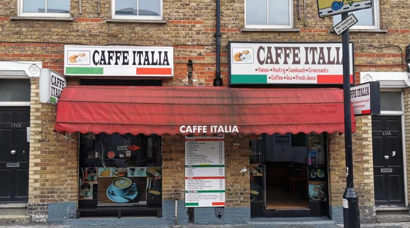 Outside Caffe Italia, a small cafe with an awning and decorated with the colours of the Italian flag